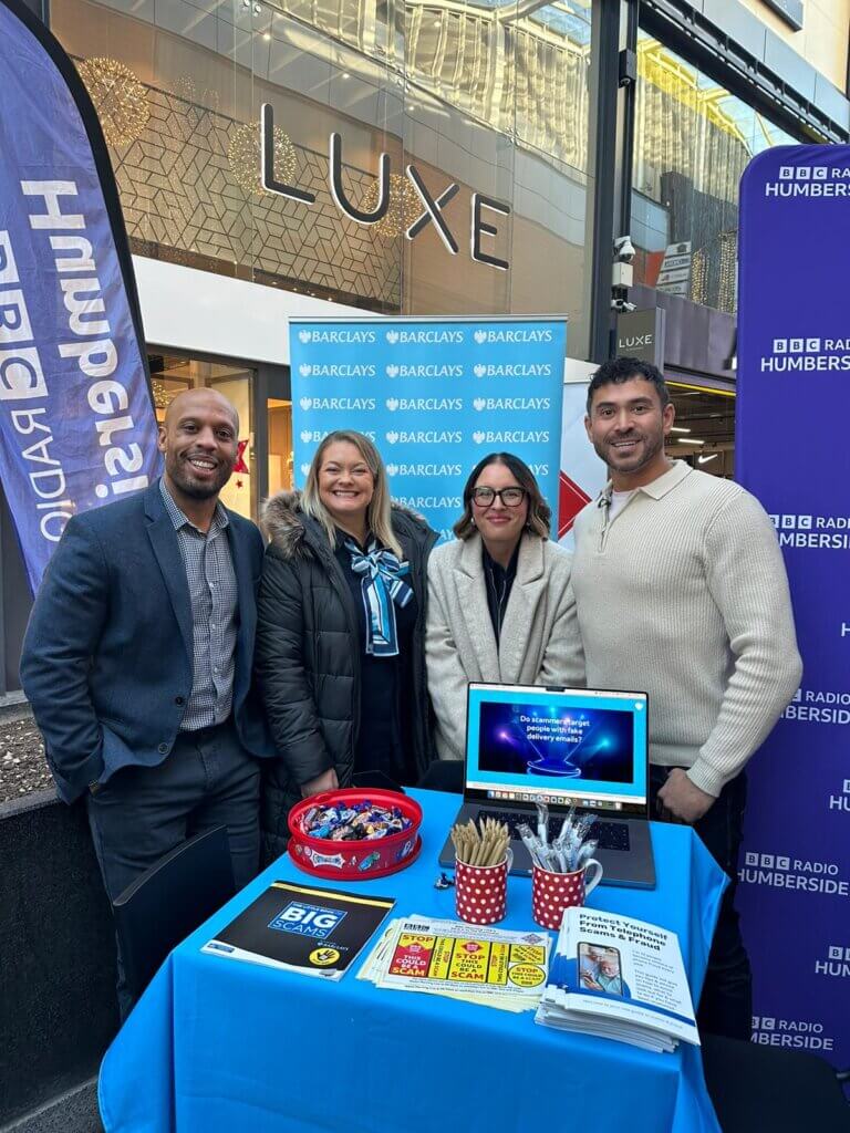 Members of the Barclays team pose for a photo with the BBC's Rav Wilding.