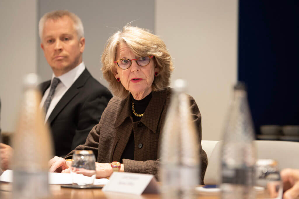 Stop Scams Chair Ruth Evans at a round table event next to Mark Tierney